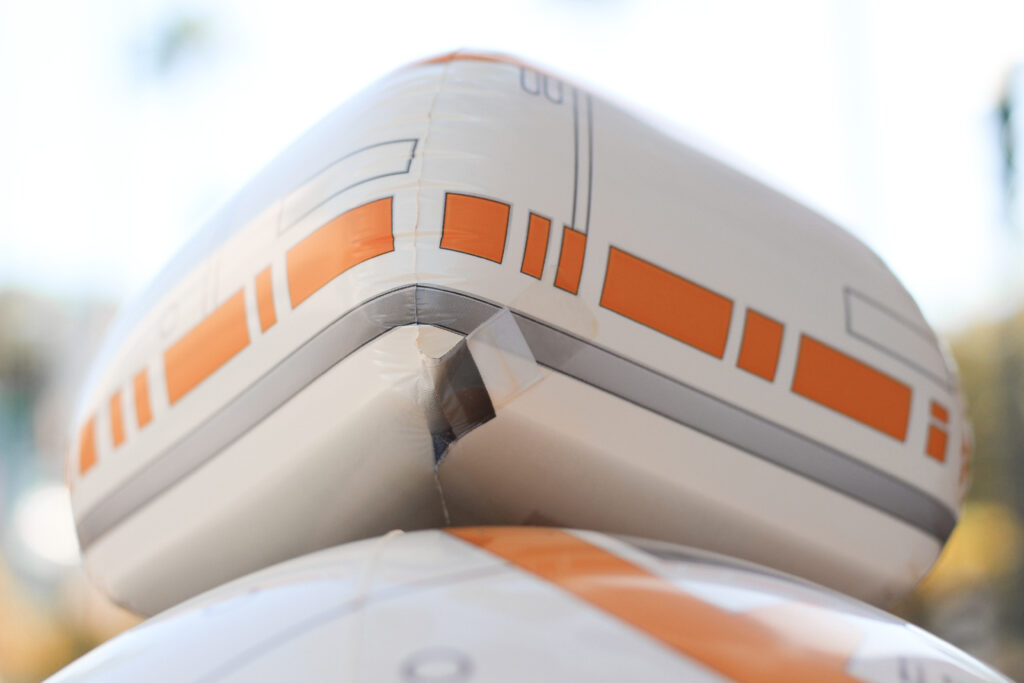 image shows the valve on a Star Wars themed BB-8 balloon that you will need to locate in order to deflate it