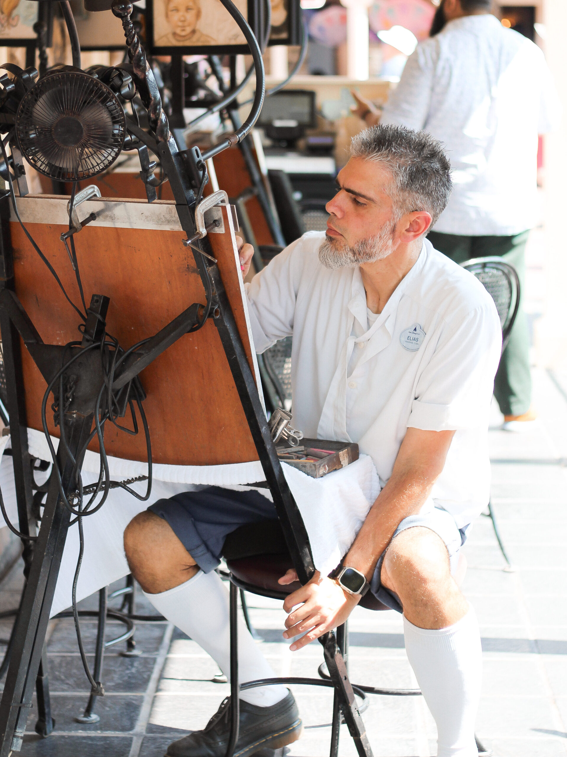 Caricature and portrait artist Elias making magic at Magic Kingdom